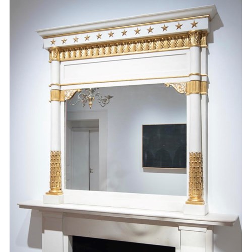 A neoclassical gilt and lacca mantel mirror
